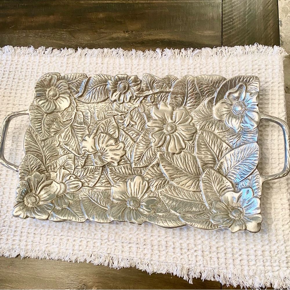 Silver plated tray with two handles.